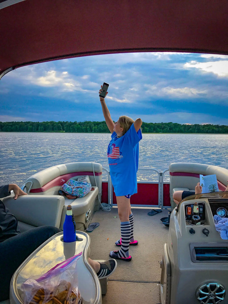Nora taking selfies on the boat.