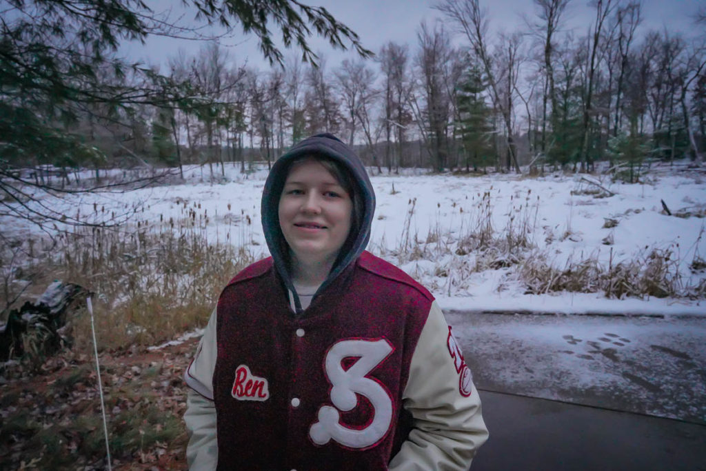 There was a bit of snow on the ground when we arrived.  Here is Nora in Ben's old letter jacket taking in the clean air.