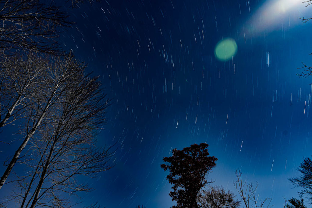 Another shot with star trails and an lens flare from the moon.