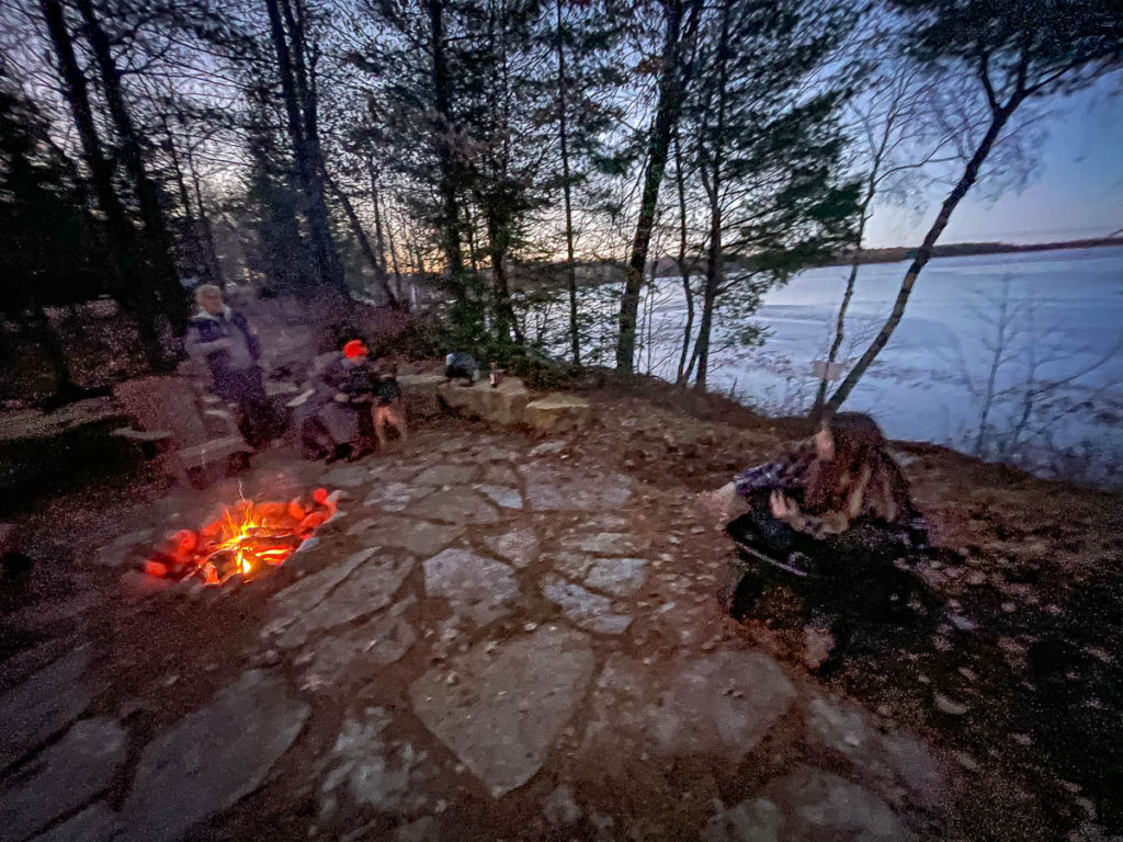 Evening by a campfire.