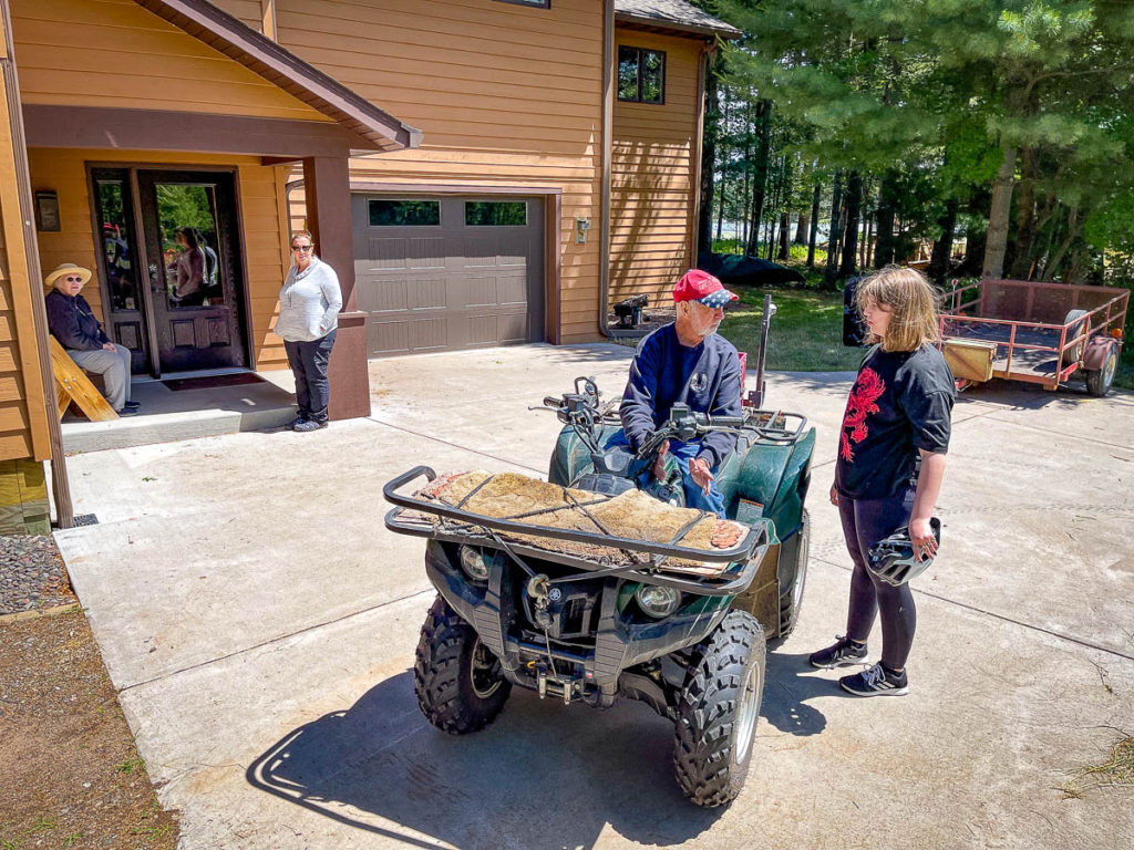Nora gets lessons on the ATV from Gandpa