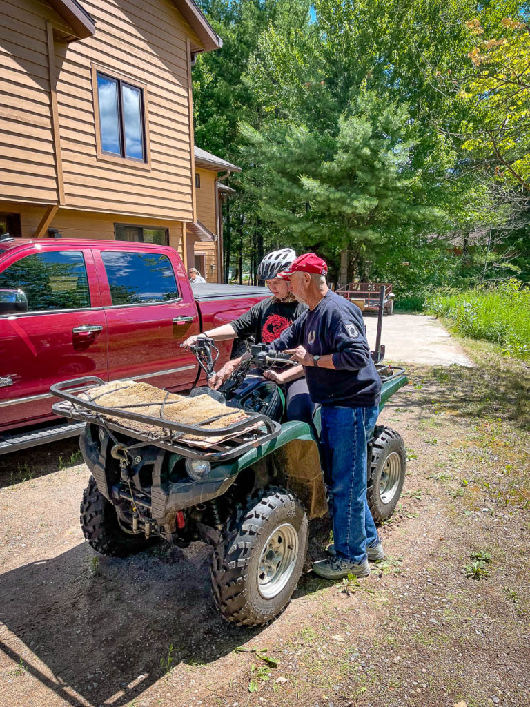Nora gets lessons on the ATV from Gandpa