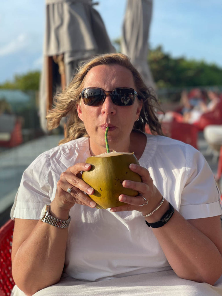 Enjoying a cocunut in the Maldives