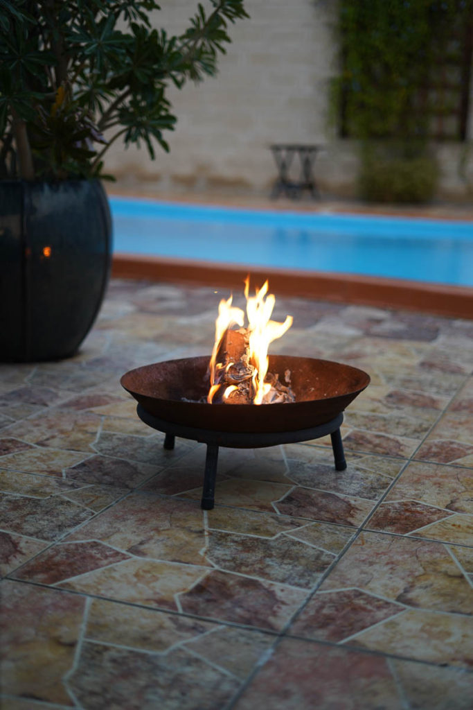 This little fire pit is perfect for the artifical logs.  It is cast iron and durable and was worth every riyal.